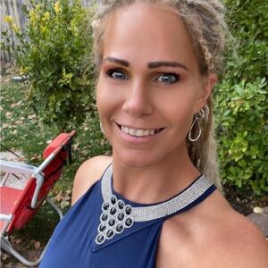 Navy blue halter dress, with knee-length liner and sheer, scalloped overlay.